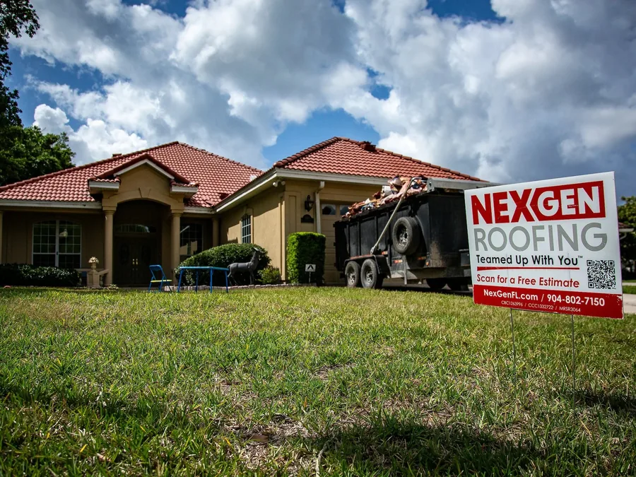 Home with a NEXGEN Roofing yard sign