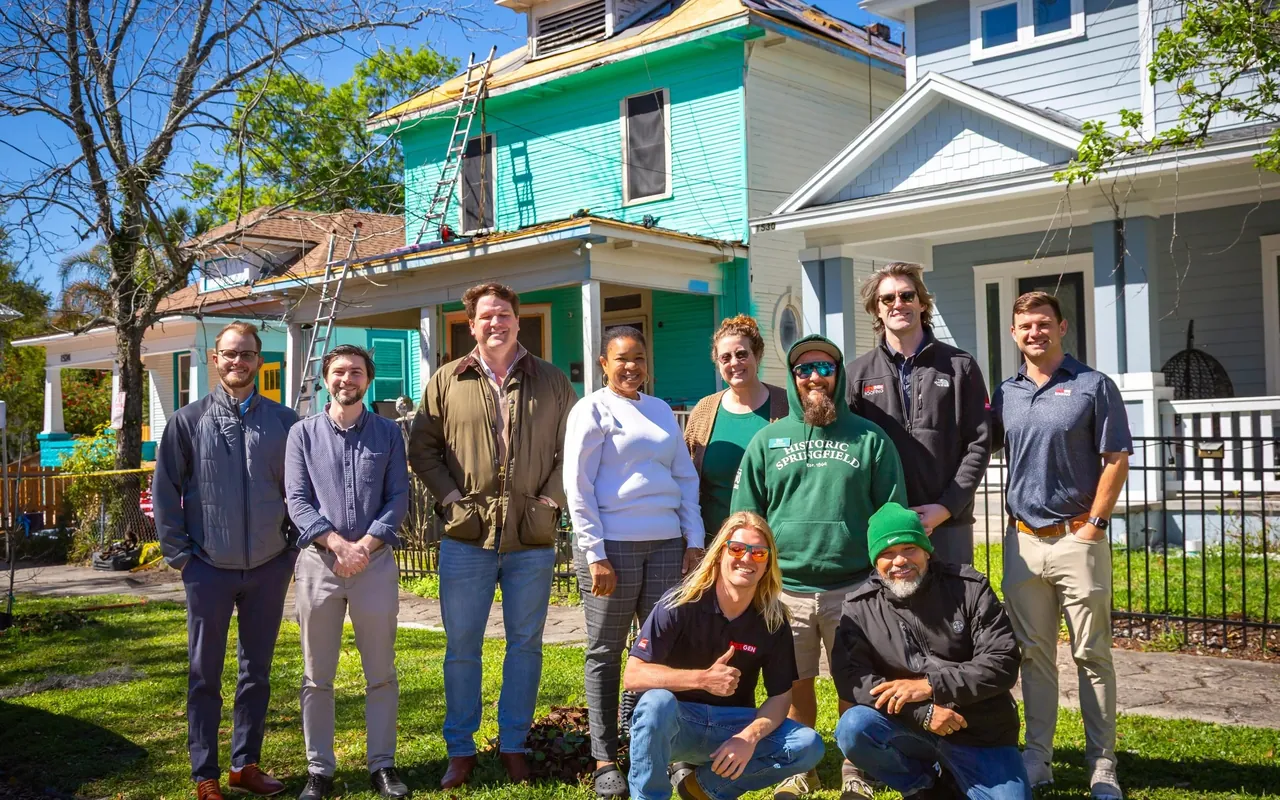 The NEXGEN Roofing team outside a home